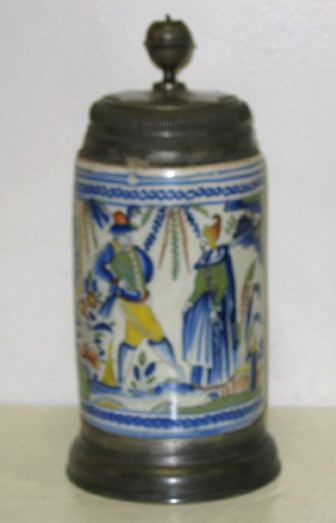 Appraisal: GERMAN PEWTER MOUNTED FAIENCE TANKARD TH C Painted in blue