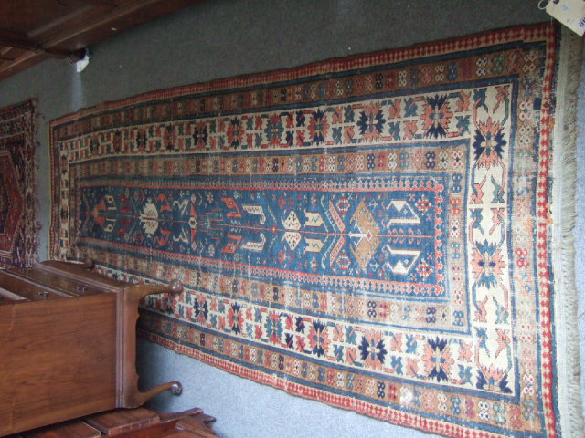 Appraisal: A Shirvan rug Caucasian the madder indigo narrow field with