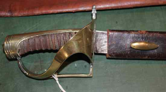 Appraisal: A Continental infantryman's hanger slightly curved broad blade brass guard