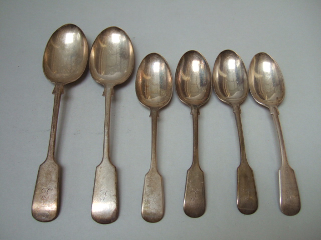 Appraisal: A pair of silver fiddle pattern table spoons Sheffield and