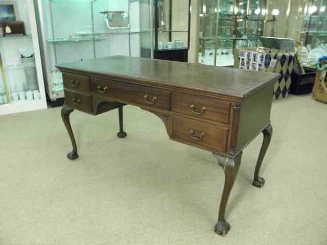 Appraisal: Chippendale style desk with a mahogany finish Two drawers on