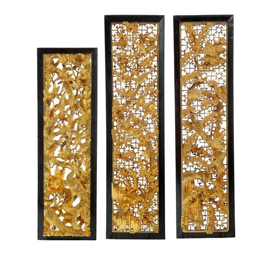 Appraisal: THREE CARVED PANELS Asian th century Carved wooden panels with