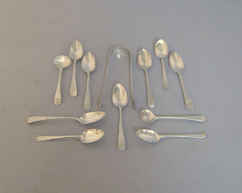 Appraisal: Eleven English silver spoons together with a bright cut sugar