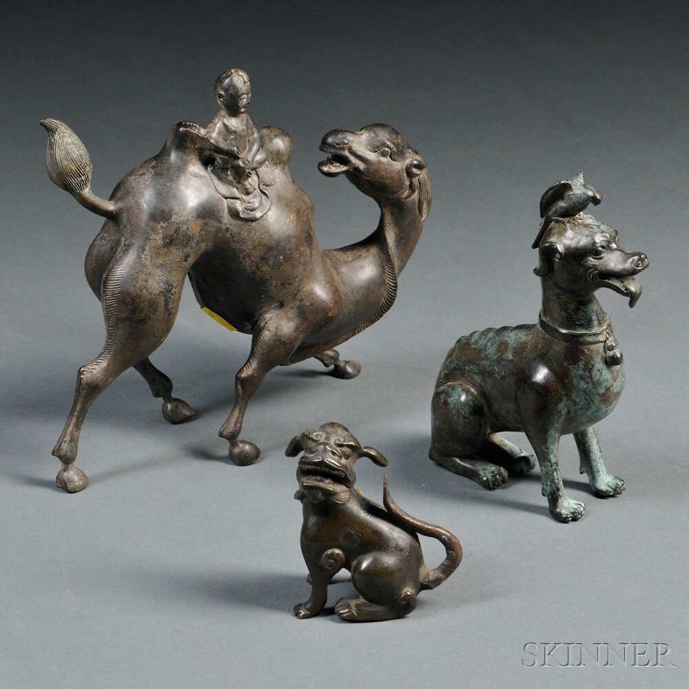 Appraisal: Three Bronze Animals China a recumbent foo dog ht a