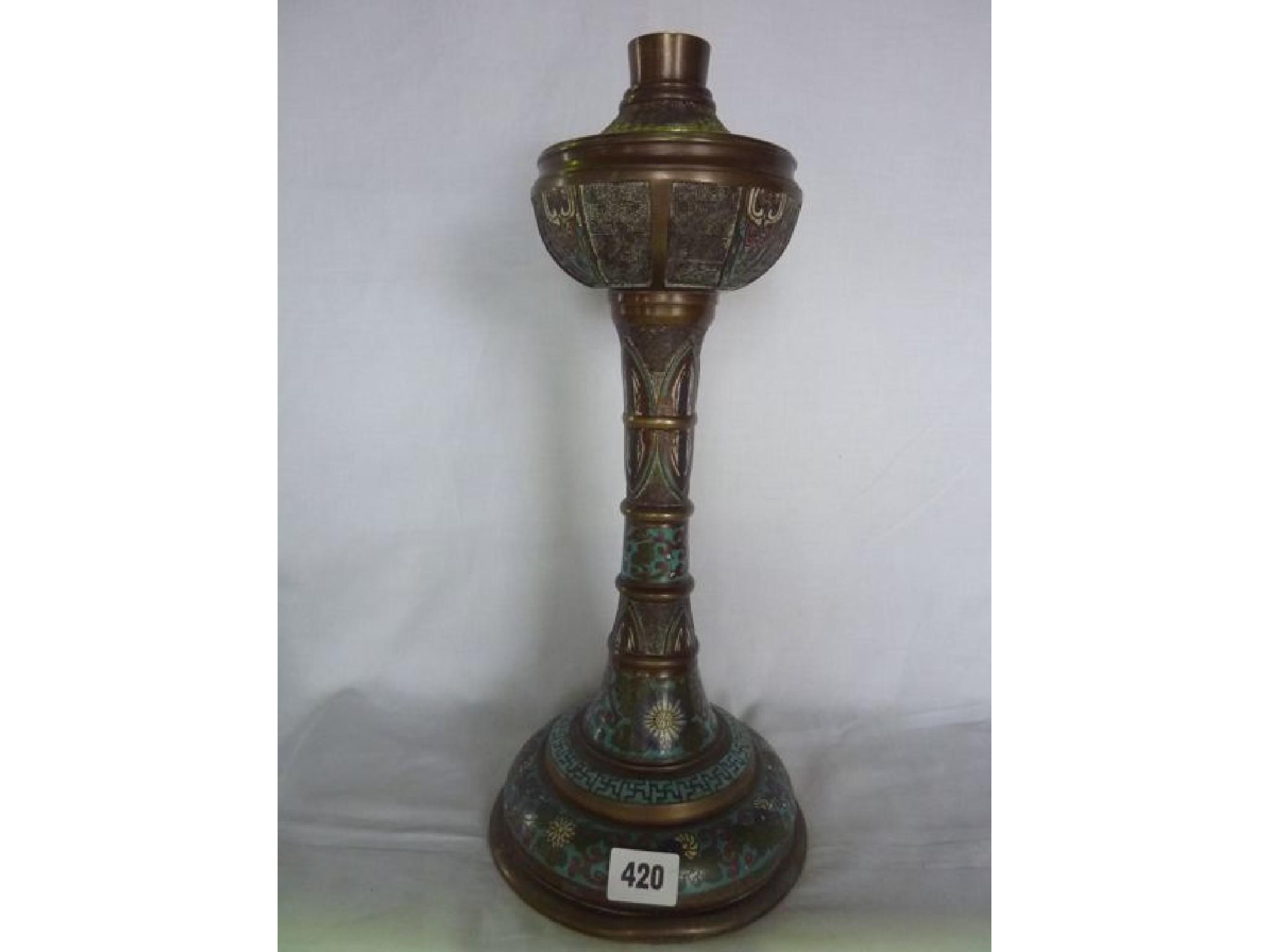 Appraisal: A brass and champleve enamel table lamp in the form