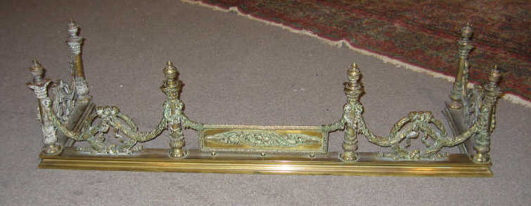 Appraisal: CONTINENTAL TH CENTURY BRASS FIREPLACE FENDER Showing six columnar posts