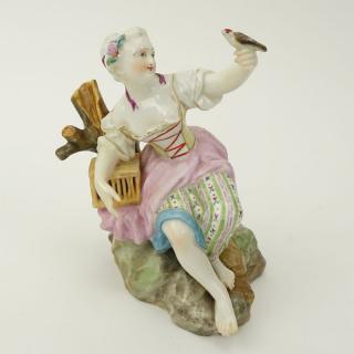 Appraisal: th Century Meissen Porcelain Seated Girl with Bird Figurine th