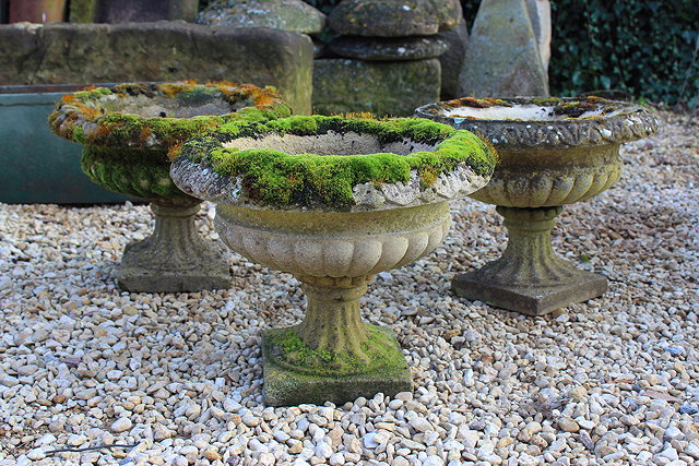 Appraisal: THREE HADDONSTONE CAMPANA URNS each with square bases cm diameter