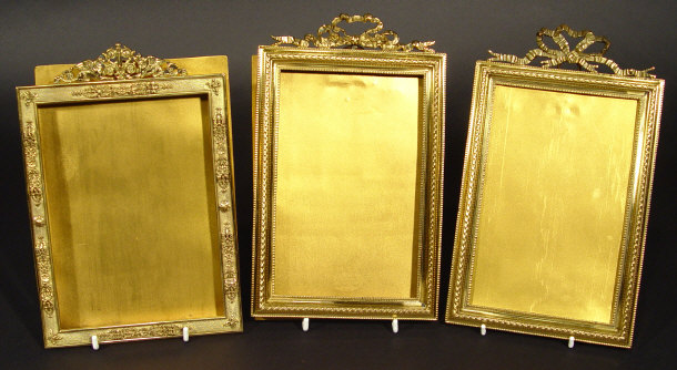 Appraisal: Three French gilt brass rectangular photo frames each surmounted with