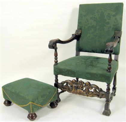 Appraisal: Carved walnut Baroque style armchair and ottoman with green upholstery