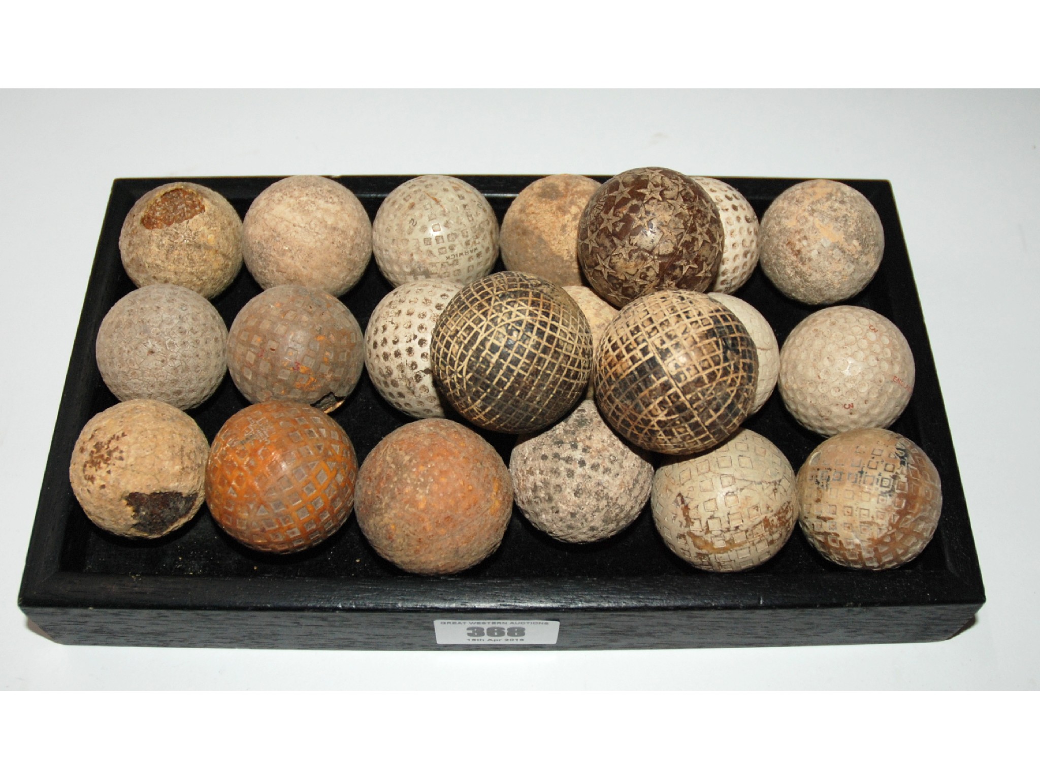 Appraisal: A collection of twenty-one mesh and dimple-pattern golf balls including