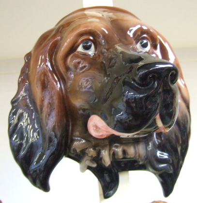 Appraisal: A Beswick wall mask modelled as a brown gloss retriever