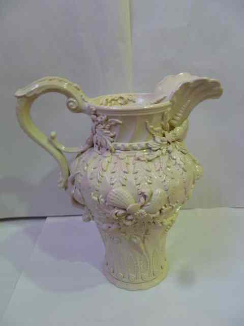 Appraisal: AN ITALIAN WHITE CERAMIC JUG of baluster form with loop