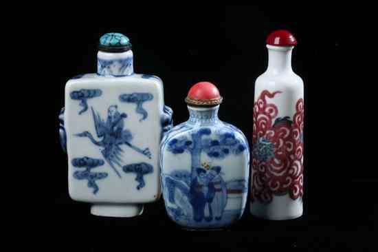 Appraisal: THREE CHINESE PORCELAIN SNUFF BOTTLES th century One copper and