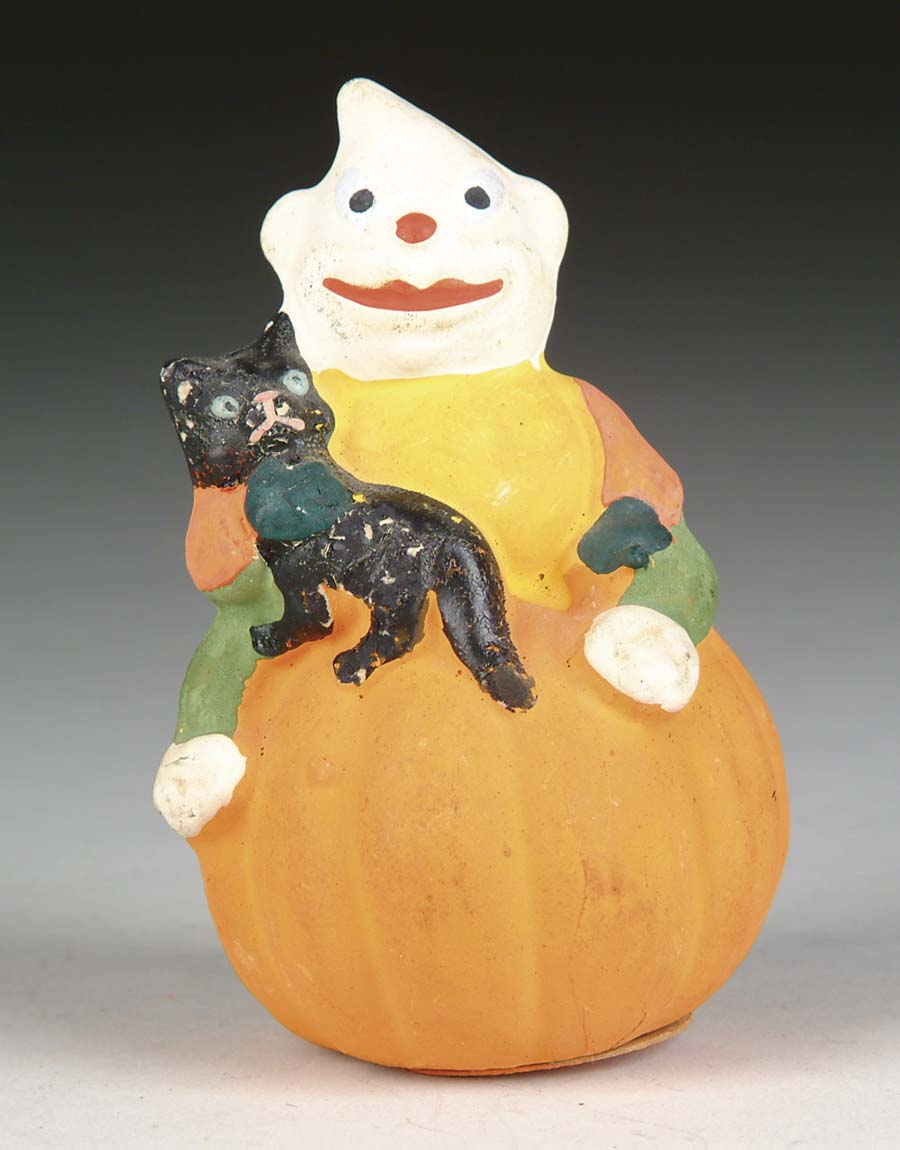 Appraisal: GOBLIN AND CAT ON PUMPKIN CONTAINER Imp-like character holds black