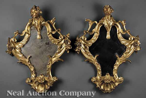 Appraisal: A Pair of Antique Continental Rococo Carved Giltwood Looking Glasses