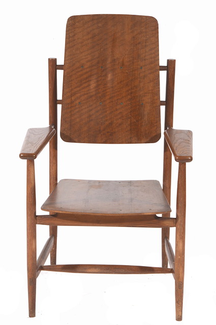 Appraisal: A Danish oak armchair in the manner of Hans Wegner