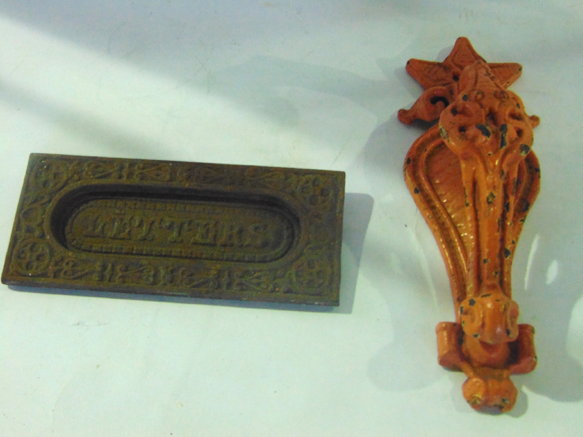 Appraisal: A late th early th century cast iron door knocker