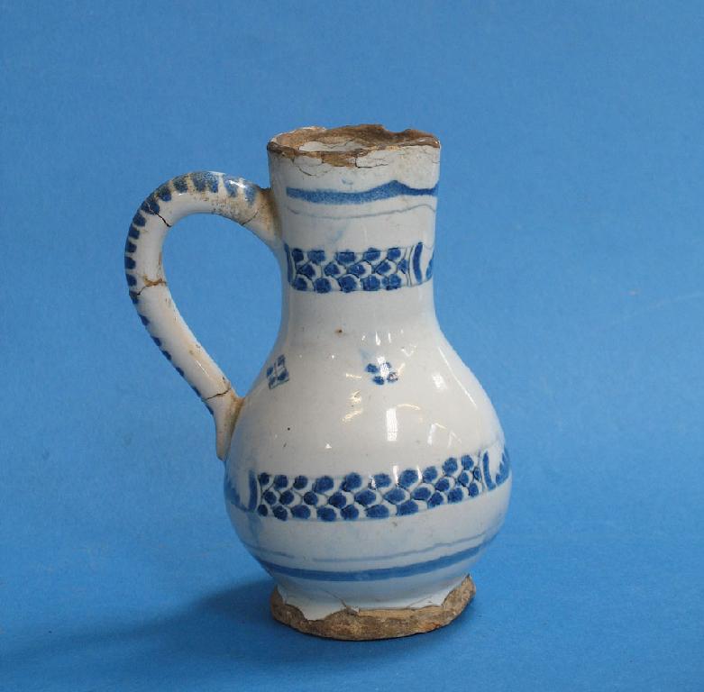 Appraisal: A NETHERLANDISH DELFTWARE MINIATURE BLUE AND WHITE JUG of baluster