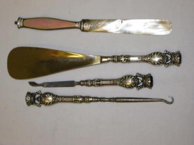 Appraisal: A THREE PIECE PART MANICURE SET comprising nail file button