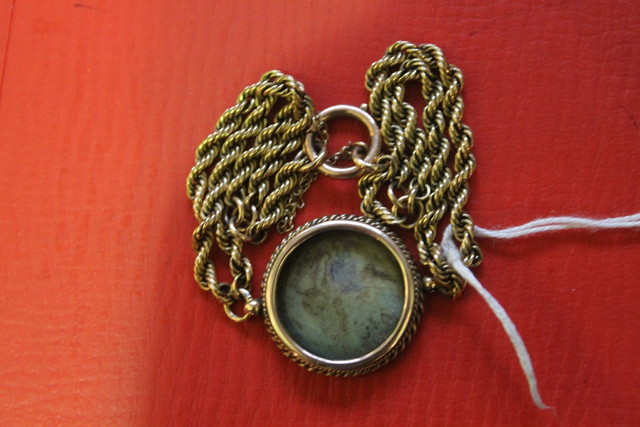 Appraisal: A VICTORIAN LOCKET and chain the chain of rope twist