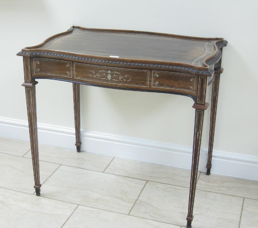 Appraisal: An Edwardian ivory inlaid rosewood tray top Occasional Table with