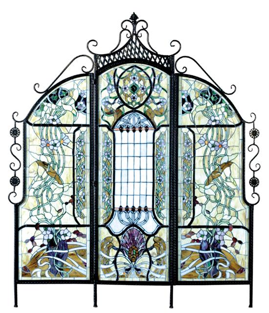 Appraisal: Three-panel stained glass screen scrolling and latticework wrought-iron frame enclosing