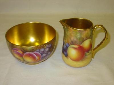 Appraisal: A ROYAL WORCESTER PORCELAIN SUGAR AND CREAM SET painted with