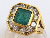 Appraisal: An carat gold emerald and diamond ring the square cut