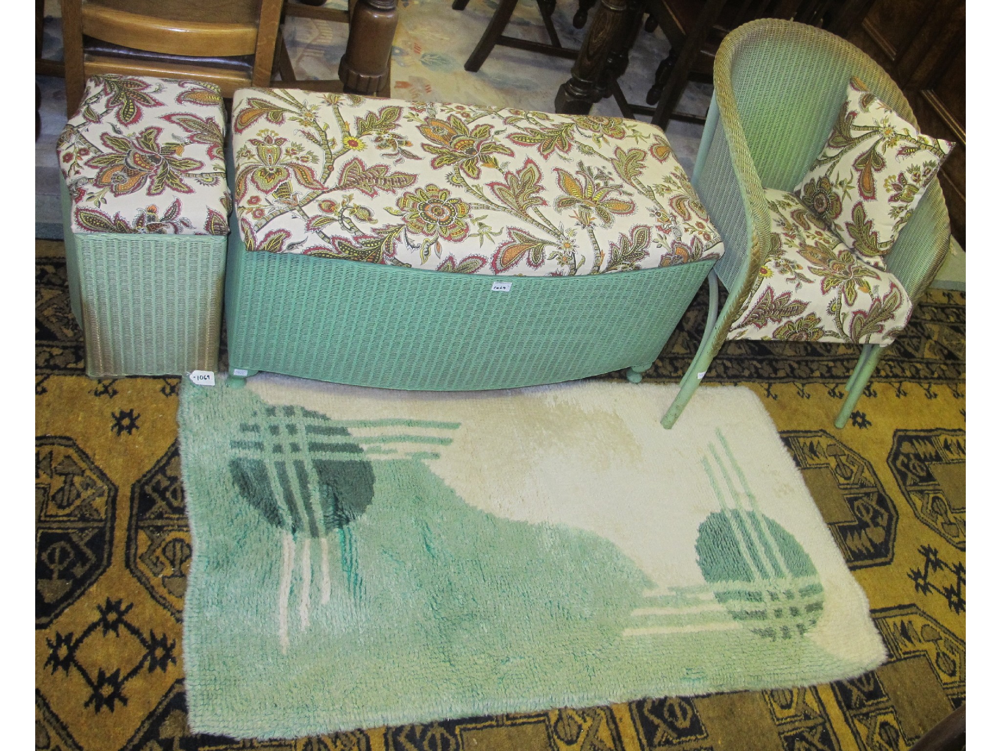 Appraisal: Lloyd Loom Ottoman tub chair linen basket and a rug