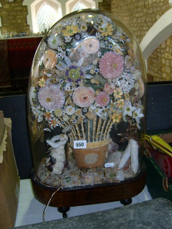 Appraisal: A Victorian shell work arrangement incorporating en elaborate basket of