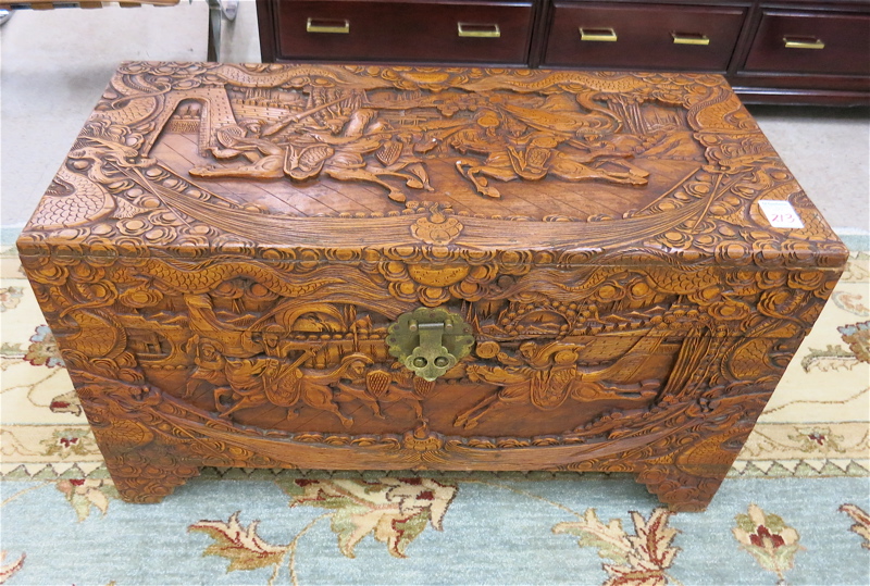 Appraisal: A RELIEF-CARVED CAMPHOR WOOD BLANKET CHEST Chinese mid- th century