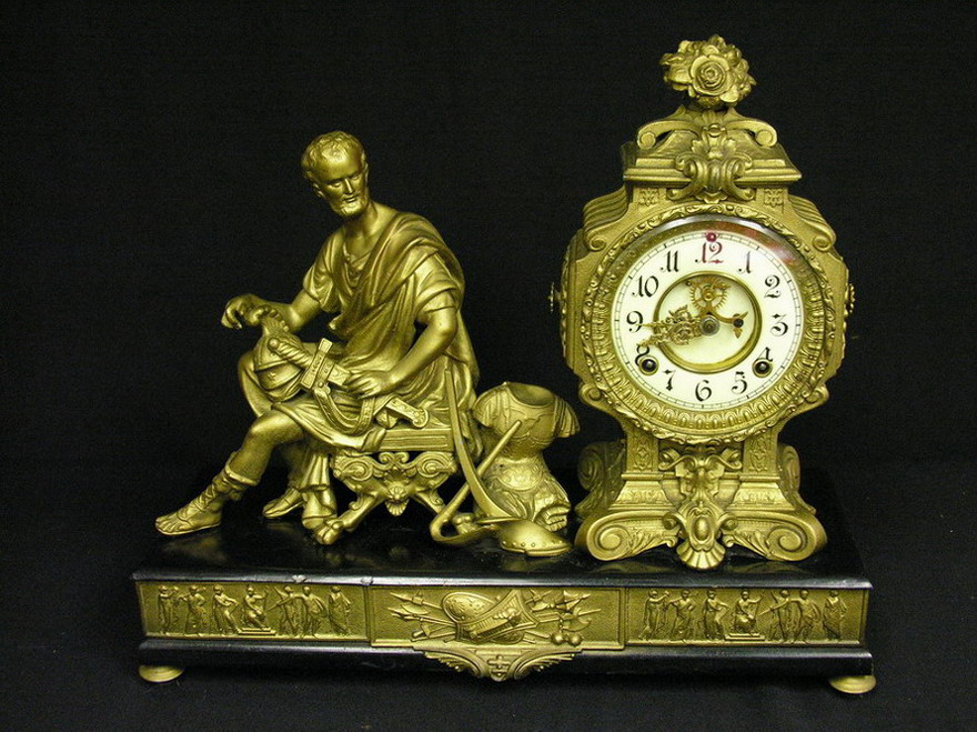 Appraisal: ANSONIA CINCINNATUS FRENCH ROCOCO CLOCK Beveled glass Porcelain dial Visible