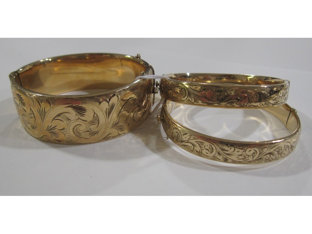 Appraisal: Three rolled gold engraved bangles