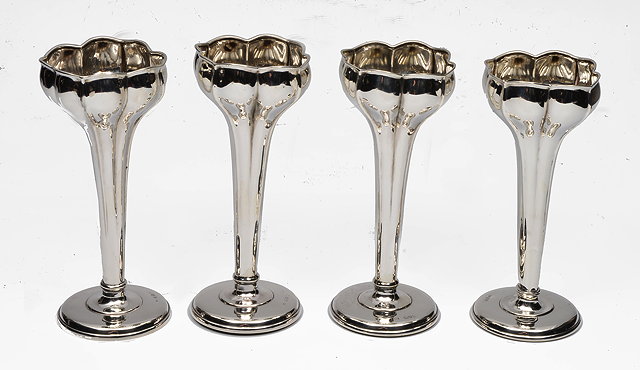 Appraisal: A SET OF FOUR SILVER VASES with tulip shaped top