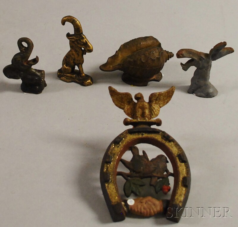 Appraisal: Three Figural Cast Iron Bottle Openers a Shell-form Bank and