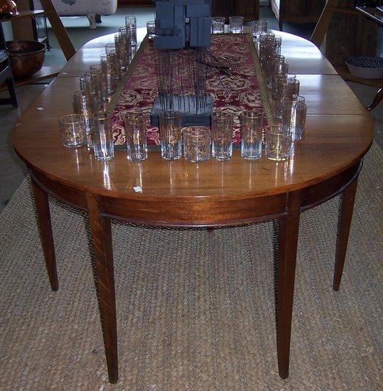 Appraisal: A George III style mahogany D-end dining table with two