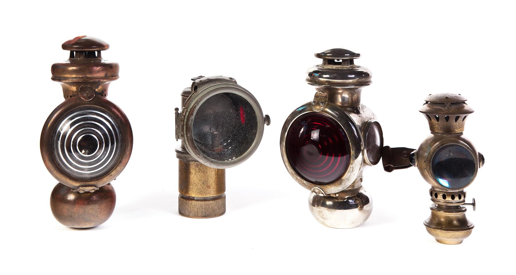 Appraisal: FOUR VEHICLE LIGHTS American early th century Two Ford headlights