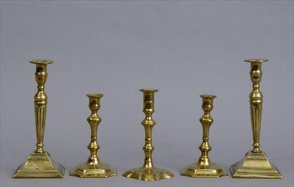 Appraisal: TWO PAIRS OF GEORGIAN BRASS TABLE CANDLESTICKS AND A SINGLE