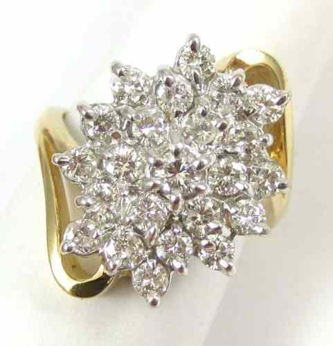 Appraisal: DIAMOND AND FOURTEEN KARAT GOLD CLUSTER RING set with round-cut