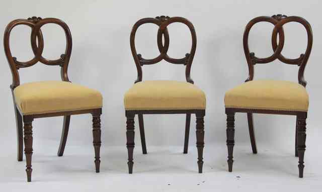 Appraisal: Three Victorian rosewood single chairs with interwoven splats to the