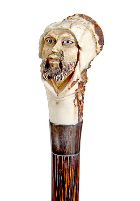 Appraisal: Stag Bedouin Cane A stag handle with carved Arabic nomad