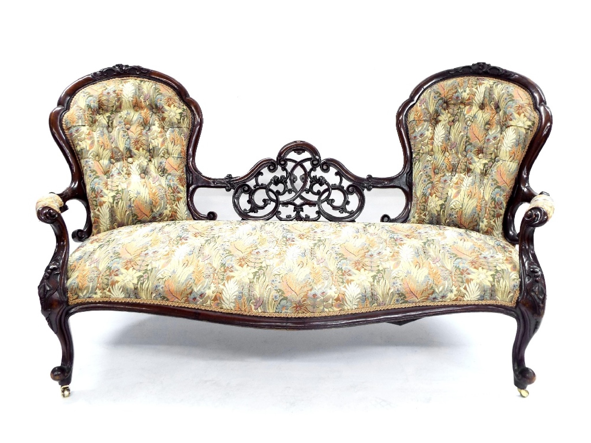 Appraisal: Victorian mahogany double spoon back sofa the two stuffover button-back