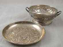 Appraisal: A white metal tests silver two handled bowl embossed with