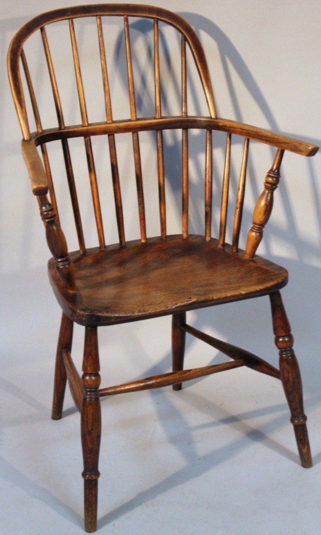 Appraisal: A thC ash and elm Windsor chair with plain hoop