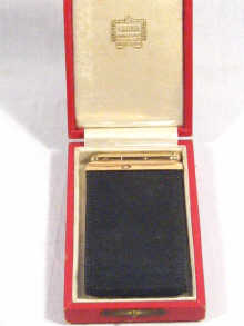 Appraisal: A Cartier carat gold and black leather notebook holder with