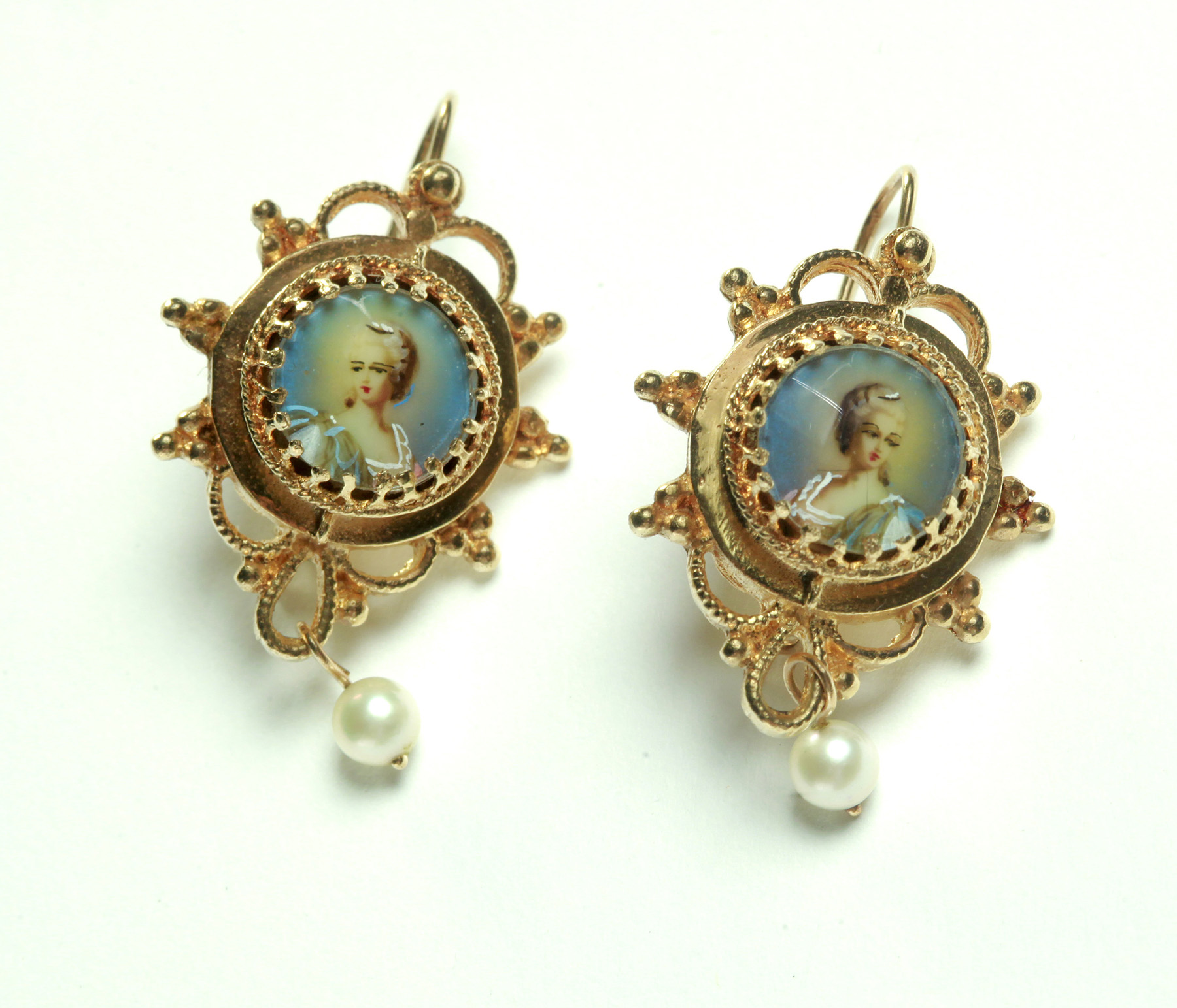 Appraisal: PAIR OF PORTRAIT EARRINGS American th century k yellow gold