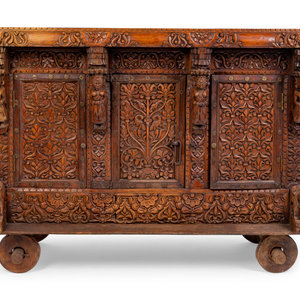 Appraisal: An Indian Carved Wood Traveling Trunk on Wheels TH TH