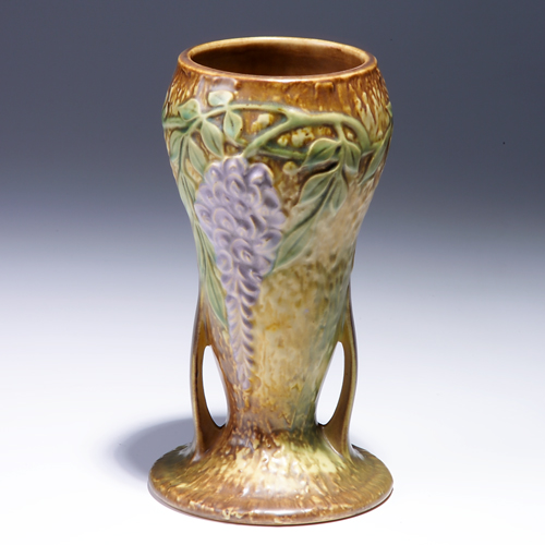 Appraisal: ROSEVILLE Brown Wisteria gourd-shaped vase with buttressed base Foil label