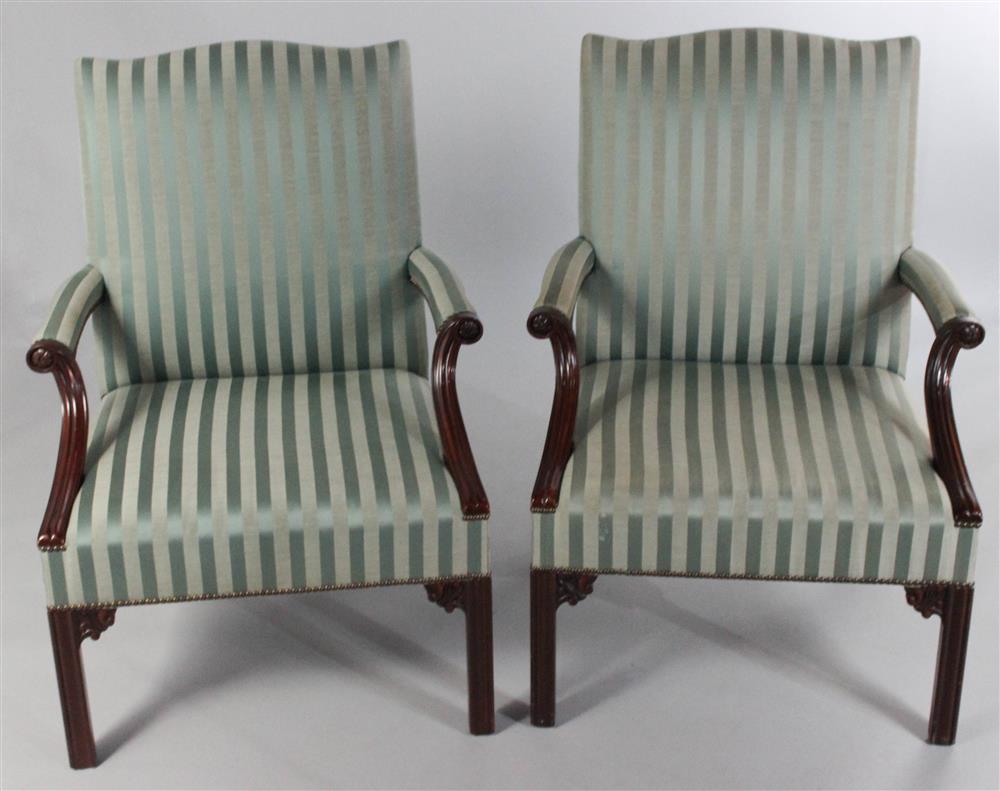 Appraisal: PAIR OF BAKER CHIPPENDALE STYLE MAHOGANY LOLLING CHAIRS serpentine crest